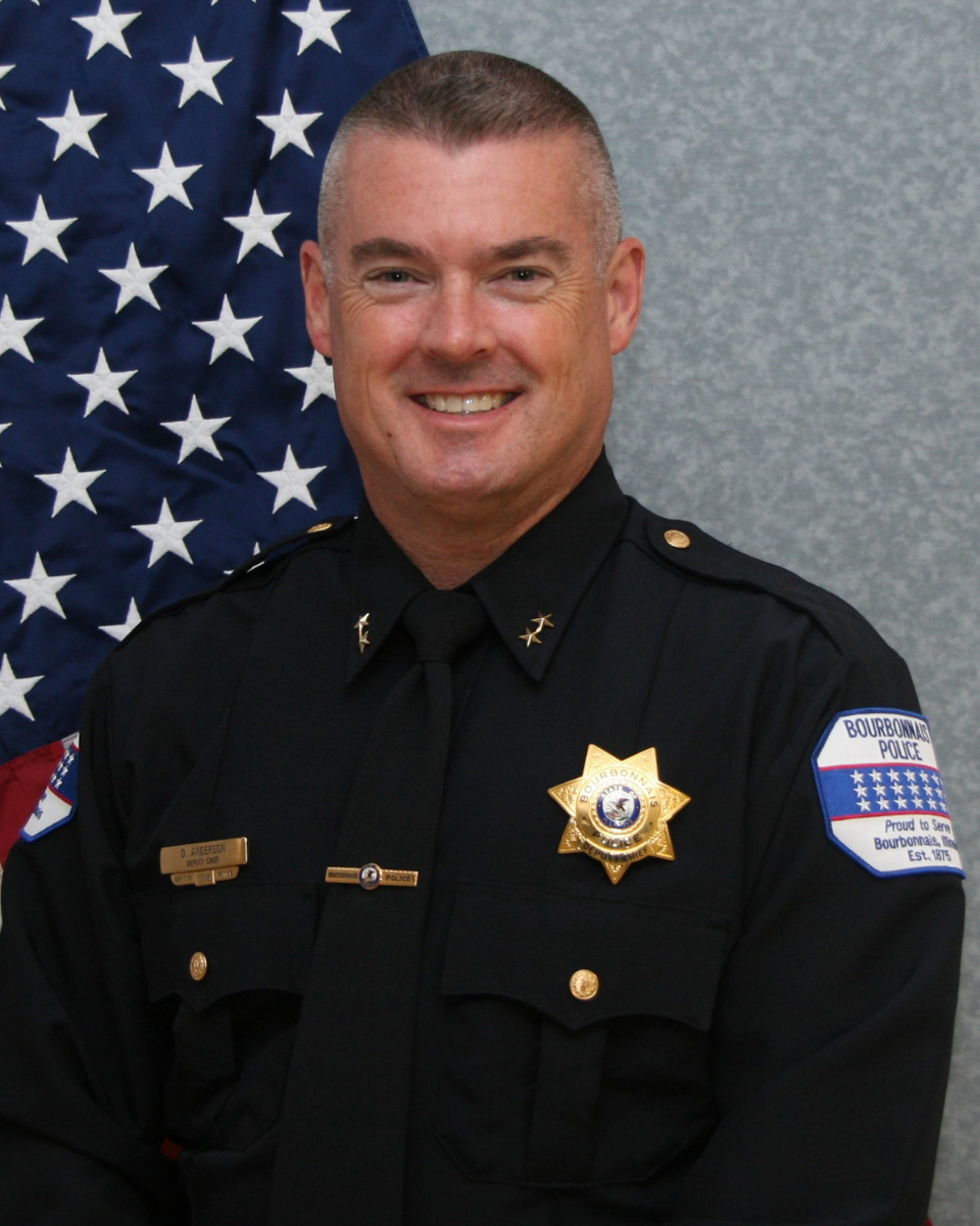 bourbonnais police officer with child during shop with a cop at target