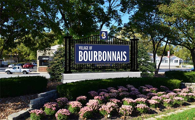 village of bourbonnais sign with flowers and landscaping
